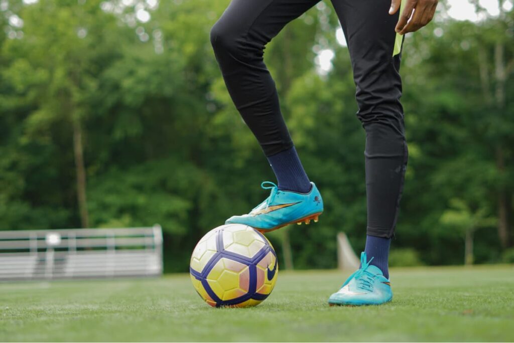 soccer player controlling a football